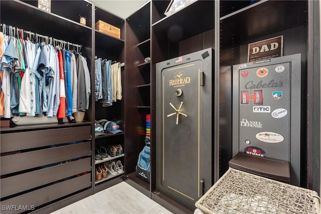 spacious closet with tile patterned flooring