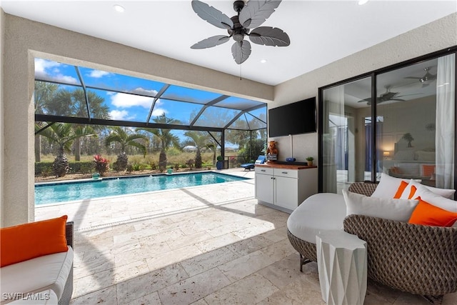 view of pool featuring ceiling fan