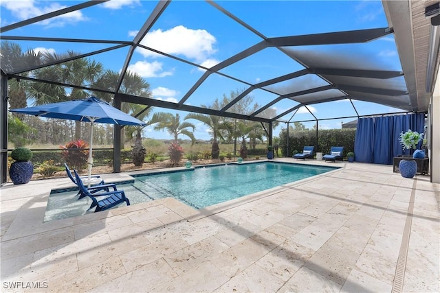 pool with a lanai and a patio