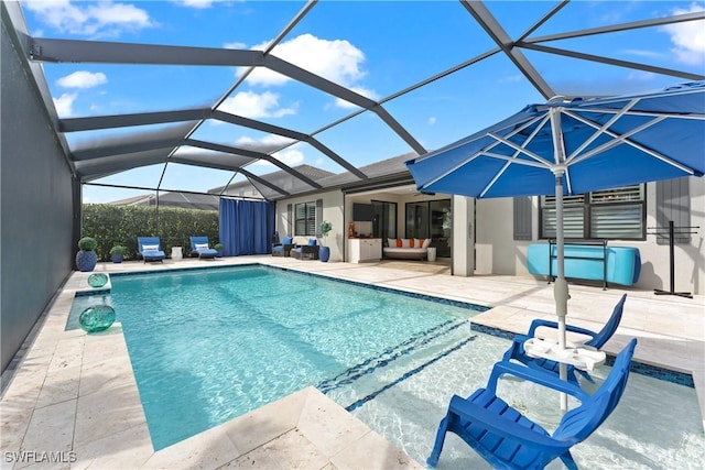 outdoor pool featuring glass enclosure, a patio, and an outdoor hangout area