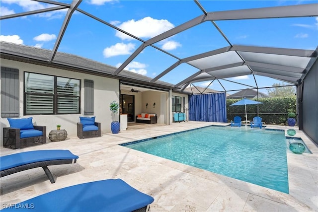 pool with a ceiling fan, a lanai, outdoor lounge area, and a patio