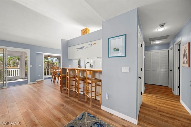 interior space with visible vents, baseboards, and wood finished floors