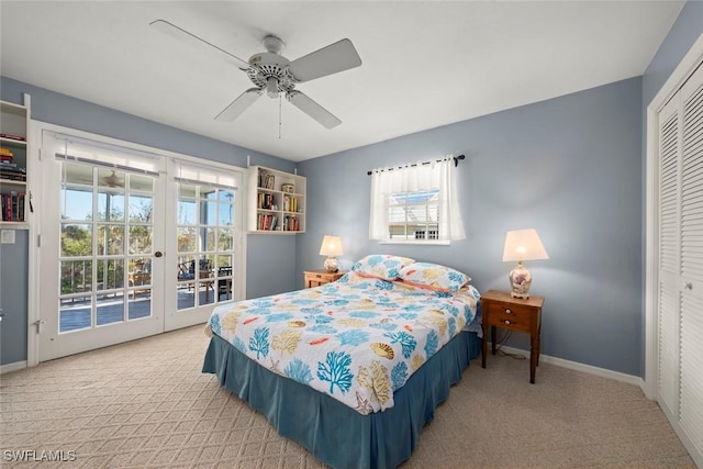 carpeted bedroom with access to exterior, multiple windows, and baseboards