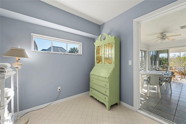 bedroom with access to exterior, baseboards, and light tile patterned floors