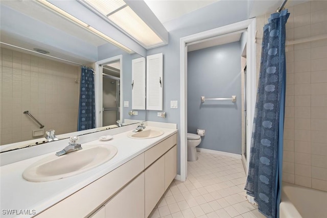 full bath with baseboards, a sink, toilet, and tile patterned floors