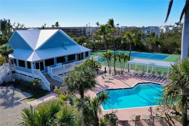 pool featuring a patio and stairs