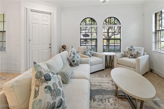 living area featuring light tile patterned floors, ornamental molding, and baseboards