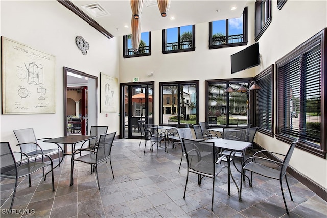 interior space with visible vents and outdoor dining area