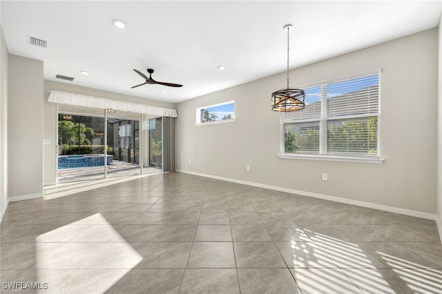 unfurnished living room with light tile patterned floors, recessed lighting, visible vents, ceiling fan, and baseboards