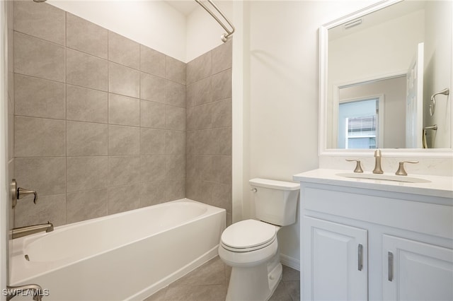 bathroom featuring bathtub / shower combination, vanity, toilet, and tile patterned floors