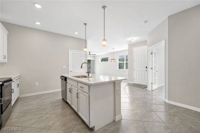 kitchen featuring light countertops, white cabinetry, a sink, an island with sink, and dishwasher