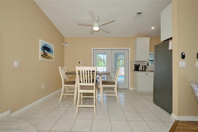 dining room featuring a ceiling fan, french doors, visible vents, and light tile patterned floors