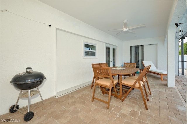 dining room with brick floor and ceiling fan