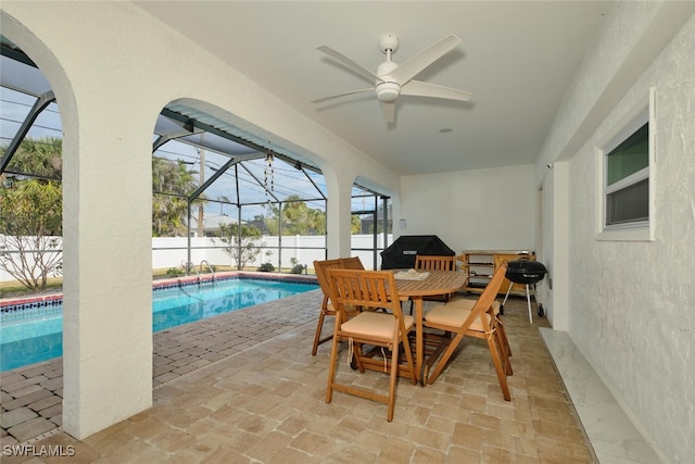 exterior space with a fenced in pool, outdoor dining space, a lanai, and a fenced backyard