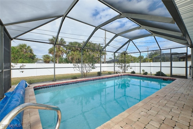 view of pool featuring a fenced backyard, a water view, a lanai, and a fenced in pool