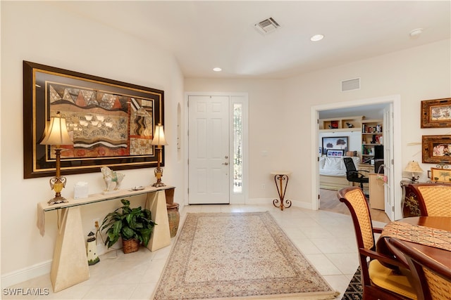 foyer entrance with recessed lighting, visible vents, baseboards, and light tile patterned flooring