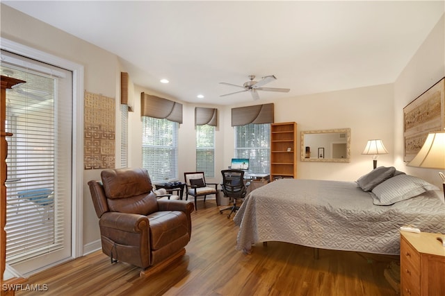 bedroom featuring ceiling fan, wood finished floors, and recessed lighting