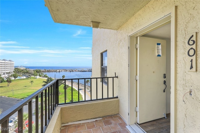 balcony featuring a water view