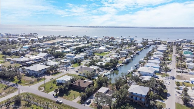 bird's eye view with a water view and a residential view