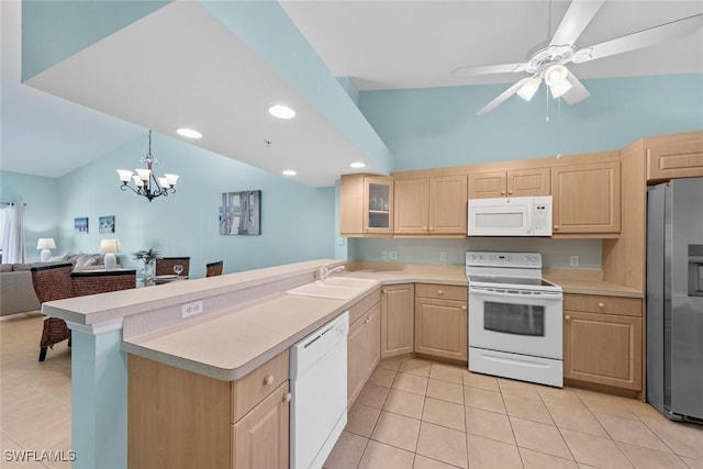 kitchen with glass insert cabinets, white appliances, light countertops, and open floor plan