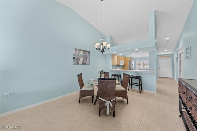 dining area featuring a notable chandelier, recessed lighting, light tile patterned flooring, high vaulted ceiling, and baseboards