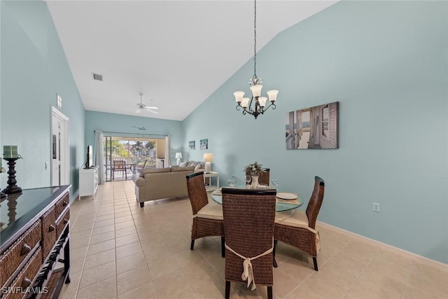 dining room featuring visible vents, baseboards, light tile patterned flooring, high vaulted ceiling, and ceiling fan with notable chandelier