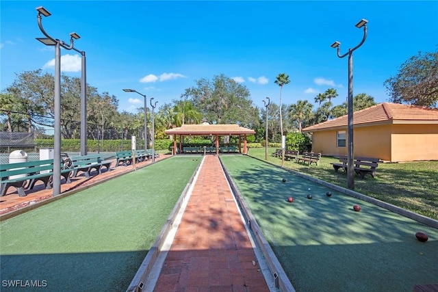 surrounding community featuring fence and a gazebo