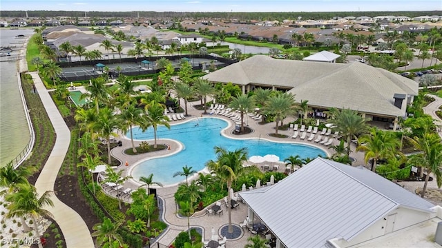 pool with a residential view and a patio area