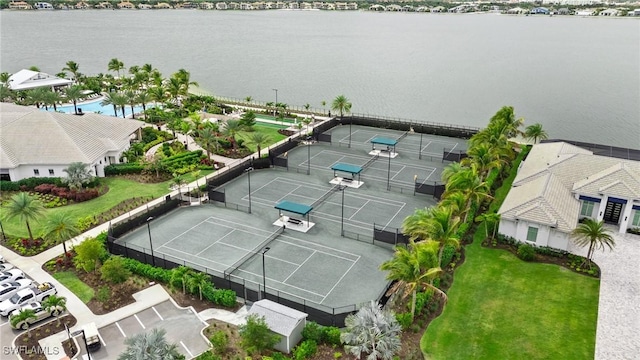 birds eye view of property with a water view