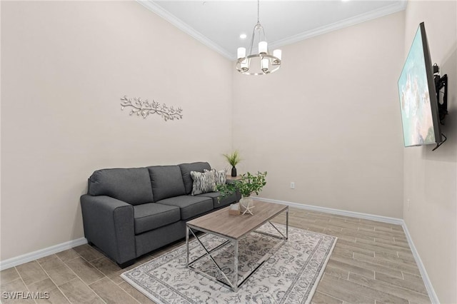 living room featuring baseboards, wood tiled floor, an inviting chandelier, and crown molding