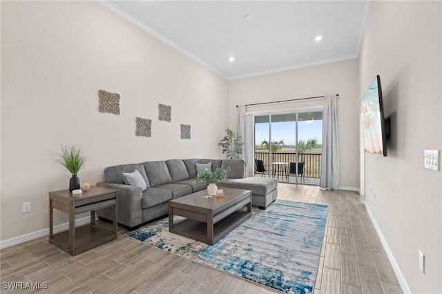 living area featuring wood tiled floor, crown molding, baseboards, and recessed lighting