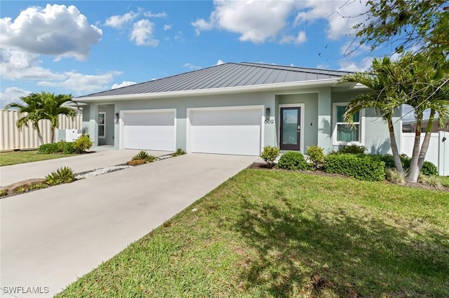 single story home with stucco siding, an attached garage, a standing seam roof, fence, and driveway