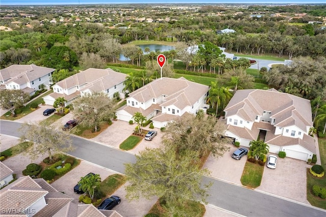 bird's eye view with a water view and a residential view