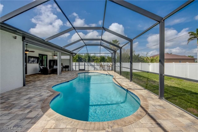 view of pool with a ceiling fan, a fenced in pool, a fenced backyard, a patio, and a lawn