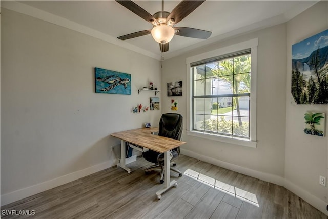 office with baseboards, a ceiling fan, and wood finished floors
