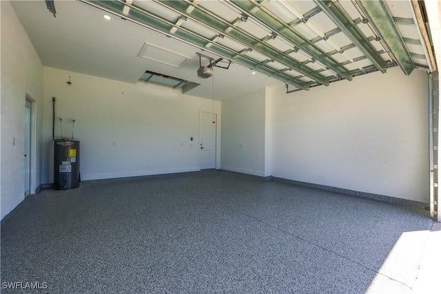 garage with a garage door opener and electric water heater