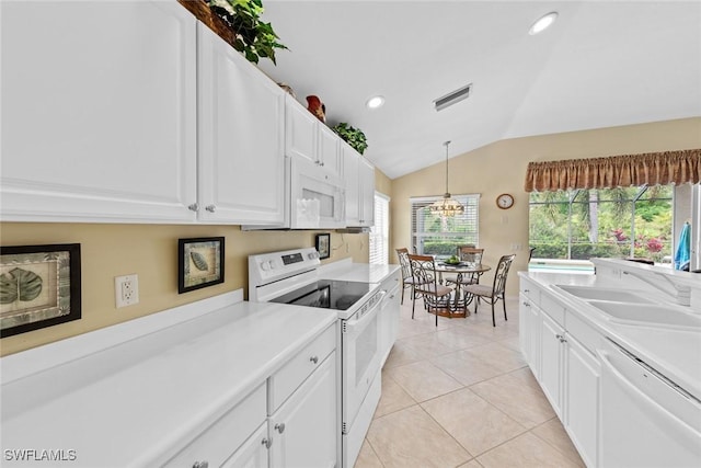 kitchen featuring white cabinets, white appliances, and light countertops