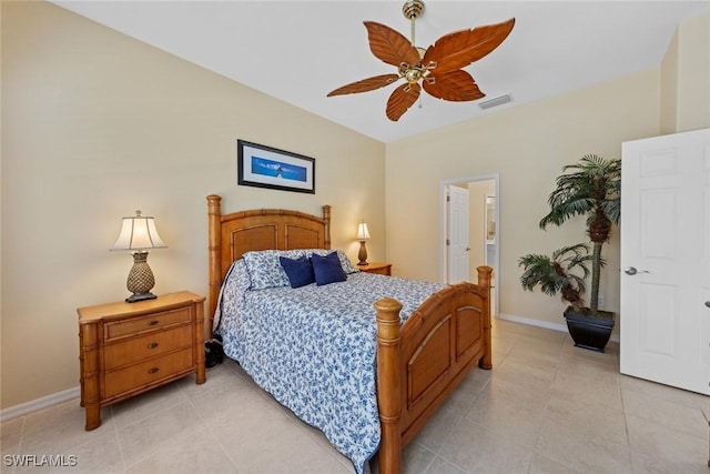 bedroom with light tile patterned floors, ceiling fan, visible vents, and baseboards