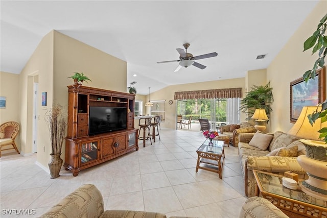 living room with lofted ceiling, light tile patterned floors, visible vents, and a ceiling fan