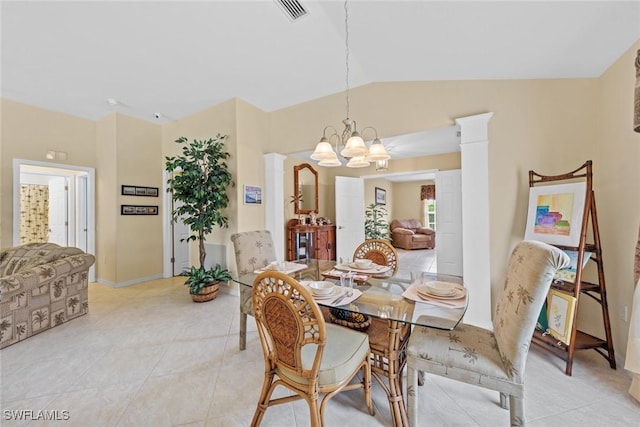 dining space featuring lofted ceiling, light tile patterned floors, a chandelier, visible vents, and ornate columns