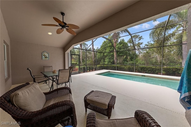 pool featuring a lanai, ceiling fan, and a patio