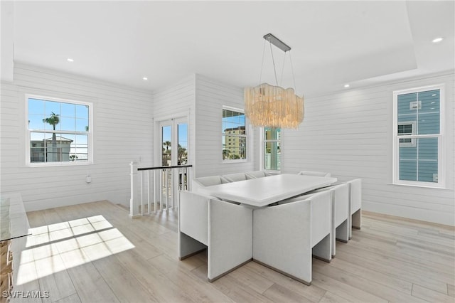 dining room with light wood-style floors, recessed lighting, and a healthy amount of sunlight