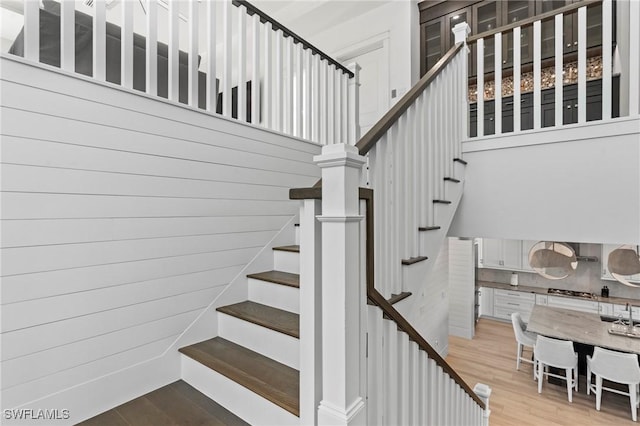 staircase with wood finished floors