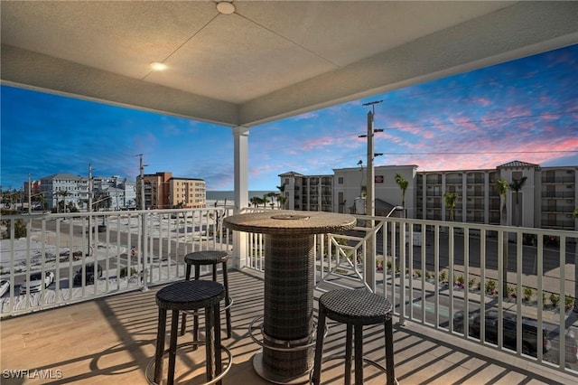 view of balcony at dusk