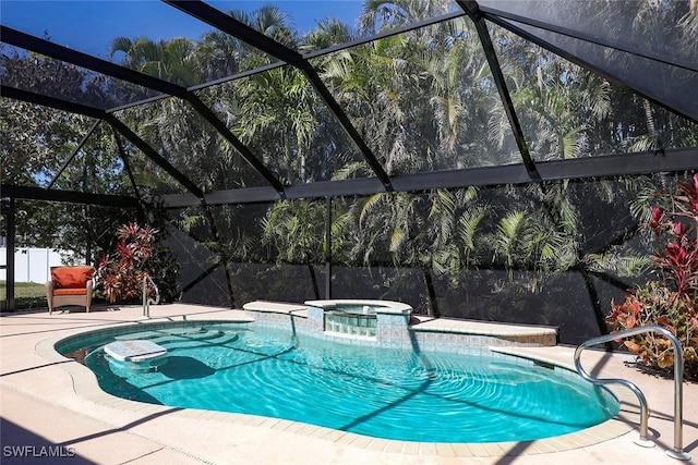 view of swimming pool with a patio area and a pool with connected hot tub