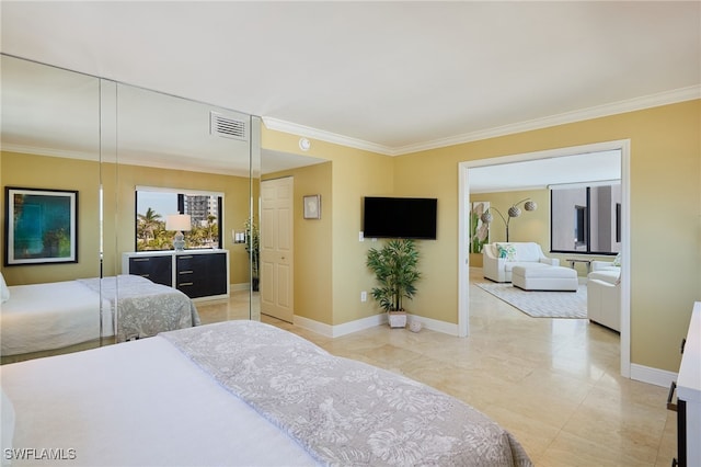 bedroom with baseboards, visible vents, and crown molding