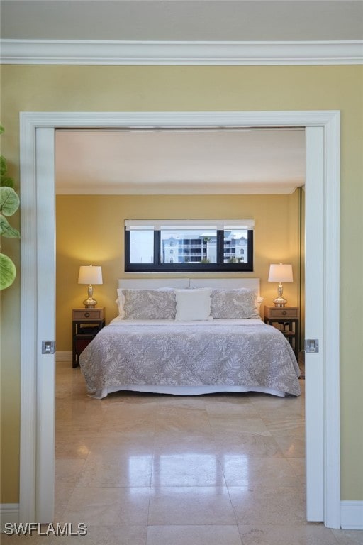 bedroom featuring baseboards and ornamental molding