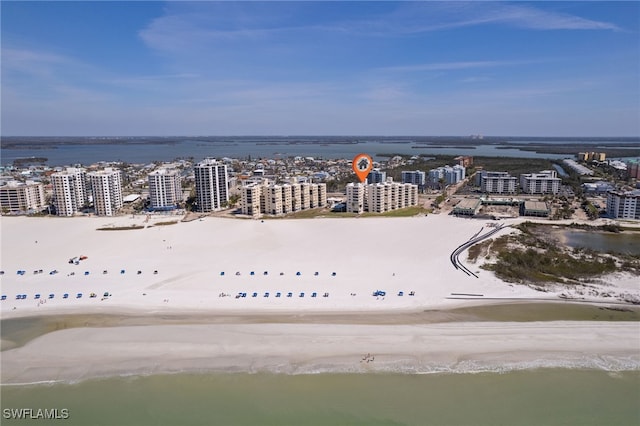 drone / aerial view featuring a view of city and a water view