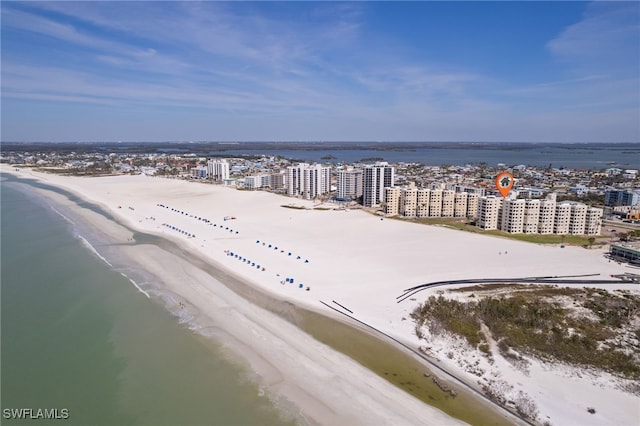 aerial view featuring a city view, a beach view, and a water view