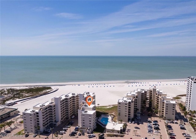 aerial view featuring a water view and a beach view